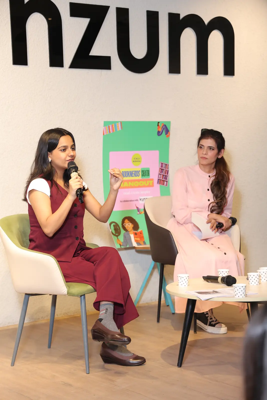 Two speakers in conversation on stage