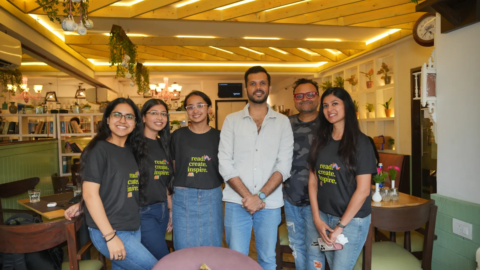 The team with the founders at the after-party